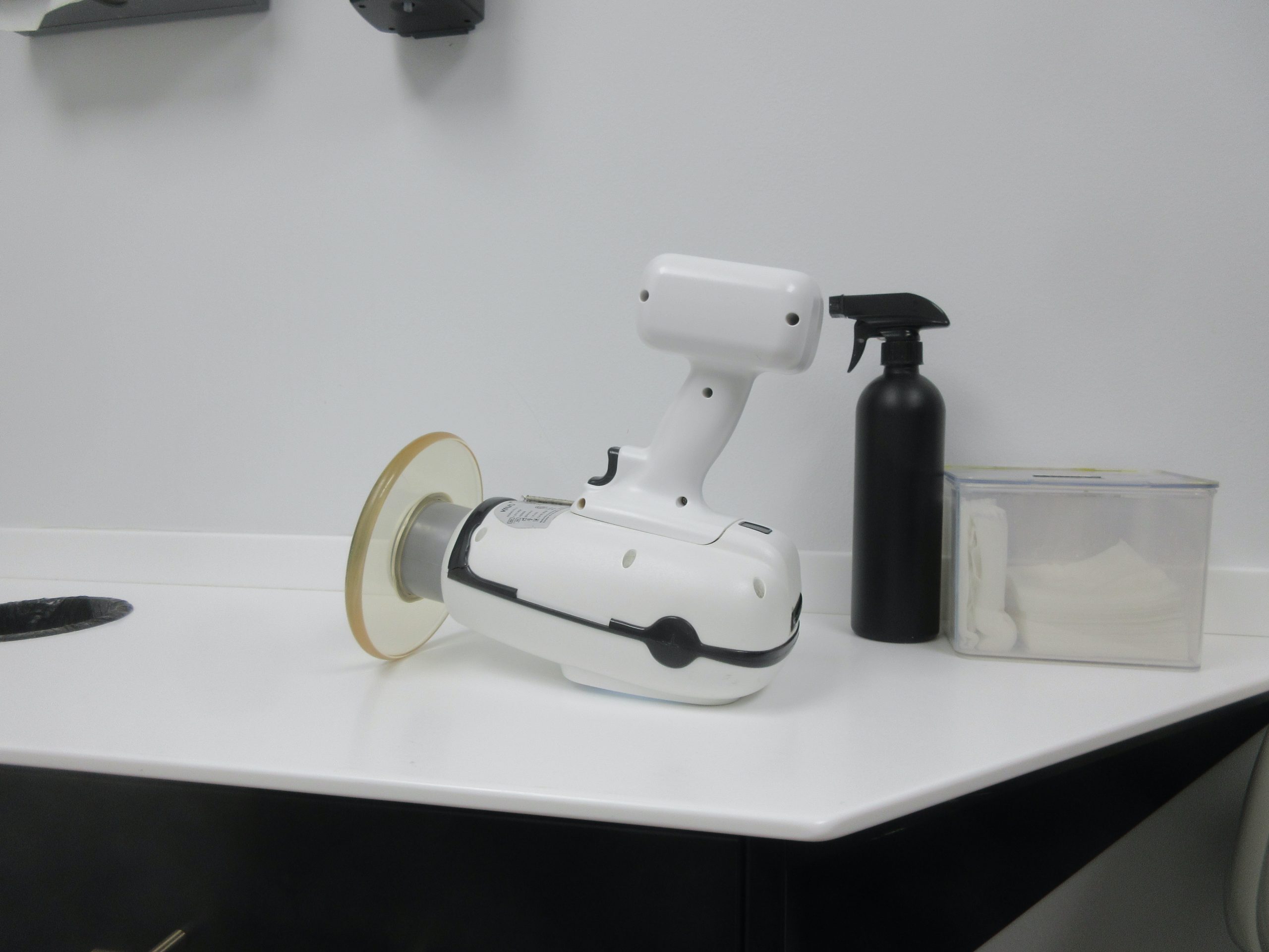 Clean, modern dental clinic operatory room equipped with ergonomic treatment chair and dental instruments